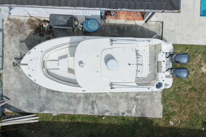 Slide: The Image of Overhead view of a 2015 Robalo R300 Center Console boat with dual engines. - 6