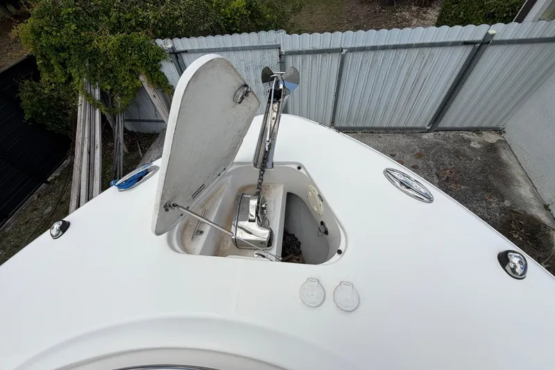 Slide: The Image of 2015 Robalo R300 Center Console boat anchor compartment with open hatch. - 8