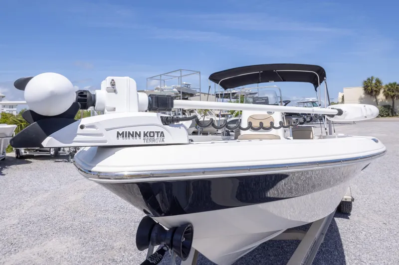 Slide: The Image of 2017 NauticStar 2400 Sport boat with Minn Kota Terrova motor, parked outdoors. - 13