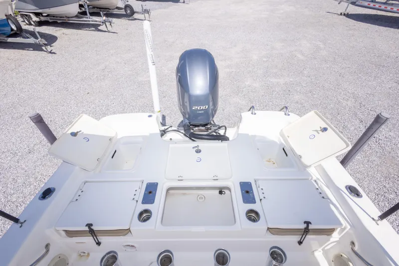 Slide: The Image of 2017 NauticStar 2400 Sport boat with 200 HP engine, featuring spacious deck layout. - 19