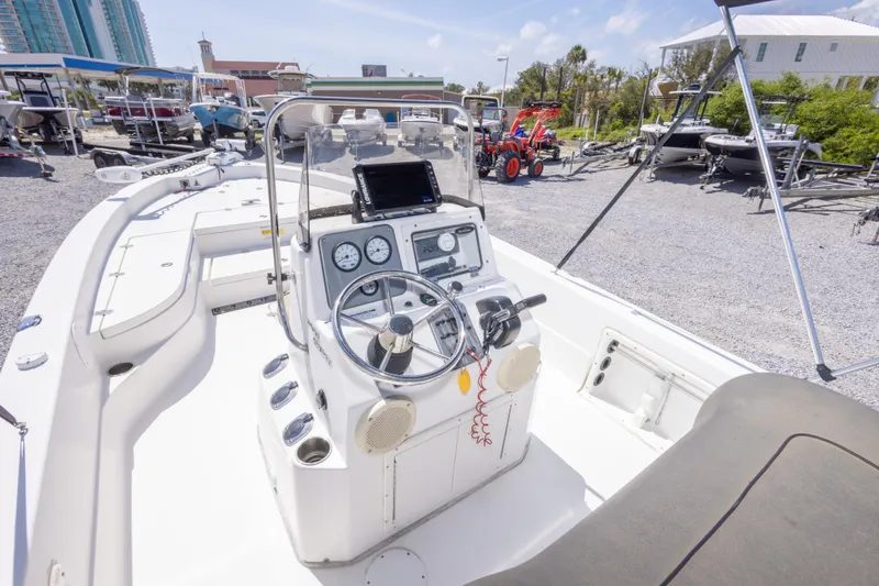 Slide: The Image of 2017 NauticStar 2400 Sport boat interior with steering console and navigation equipment. - 20