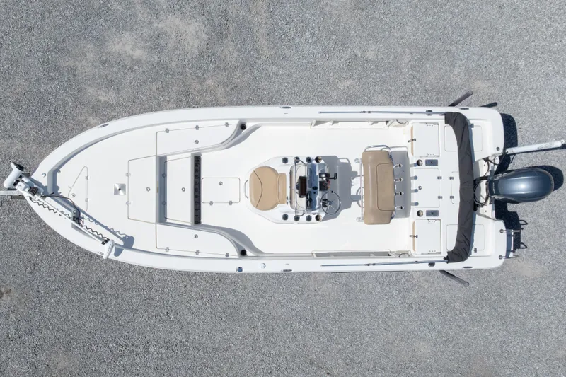 Slide: The Image of Overhead view of 2017 NauticStar 2400 Sport boat on gravel surface. - 3