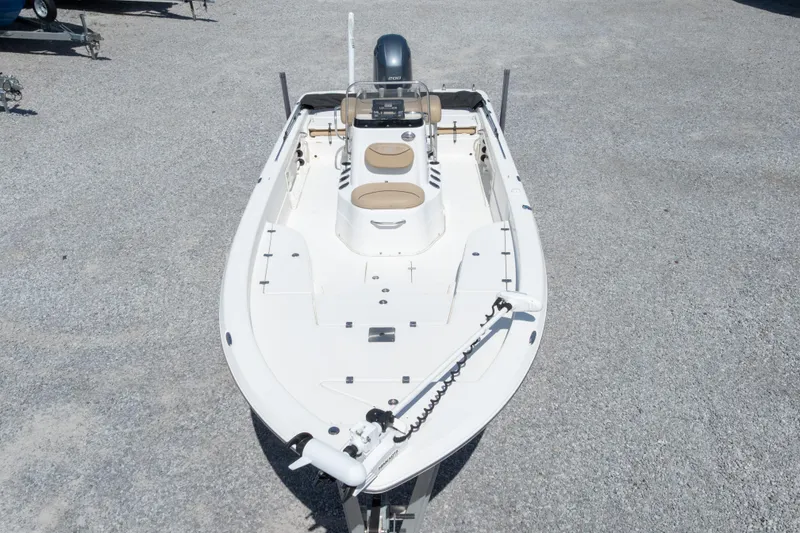 Slide: The Image of 2017 NauticStar 2400 Sport boat on gravel lot, top view. - 40