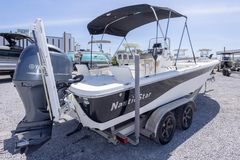 Slide: The Image of 2017 NauticStar 2400 Sport boat on trailer with Yamaha outboard motor. - 8