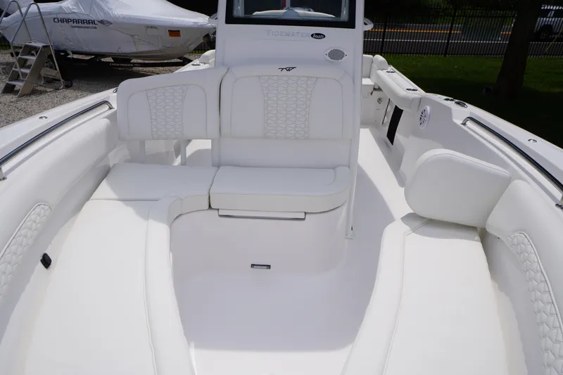 Slide: The Image of 2026 Tidewater 232 SS boat interior with white seating and modern design. - 14