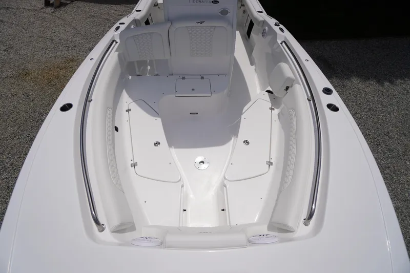 Slide: The Image of 2026 Tidewater 232 SS boat interior with white seating and sleek design. - 18