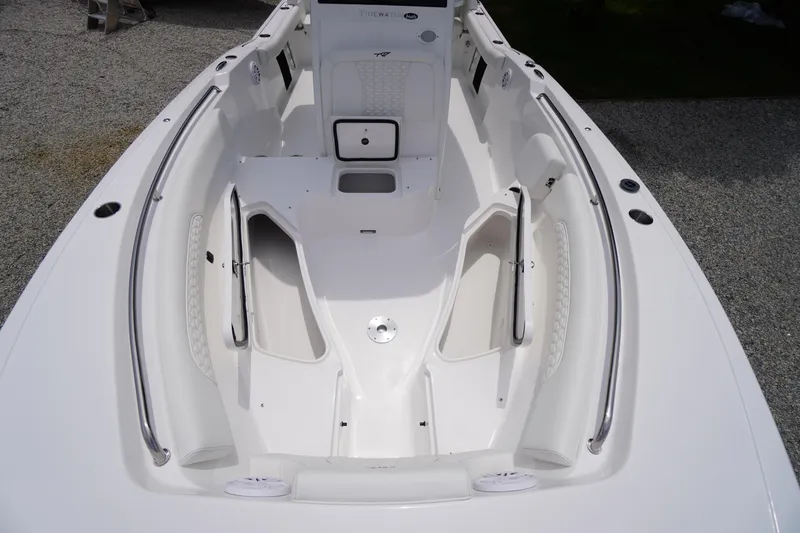 Slide: The Image of 2026 Tidewater 232 SS boat interior with spacious seating and storage compartments. - 19
