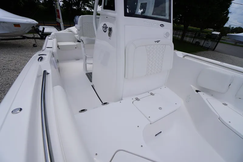 Slide: The Image of 2026 Tidewater 232 SS boat interior with white seating and sleek design. - 23