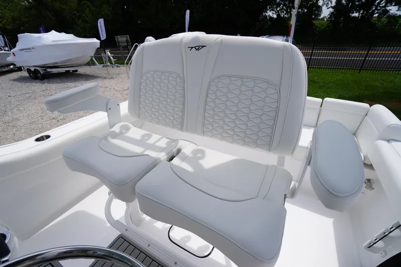 Slide: The Image of 2026 Tidewater 232 SS boat with white cushioned seating and modern design. - 41