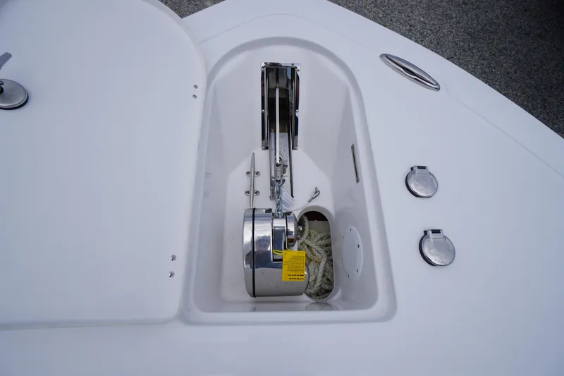 Slide: The Image of Anchor compartment of 2026 Tidewater 232 SS boat, featuring a neatly stored anchor and rope. - 6