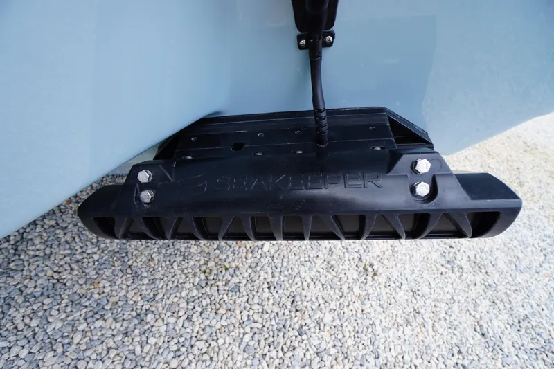 Slide: The Image of 2026 Tidewater 232 SS boat with Seakeeper stabilizer on gravel surface. - 76