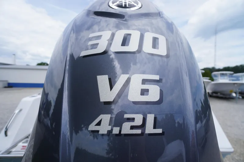 Slide: The Image of Close-up of a 2026 Tidewater 232 SS boat engine, featuring 300 V6 4.2L specifications. - 79