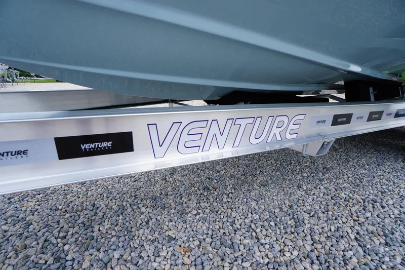 Slide: The Image of 2026 Tidewater 232 SS on Venture trailer, parked on gravel. - 82