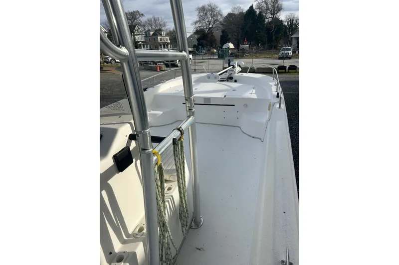 Slide: The Image of 2011 Carolina Skiff 258 DLV boat interior with metal railings and open deck. - 6