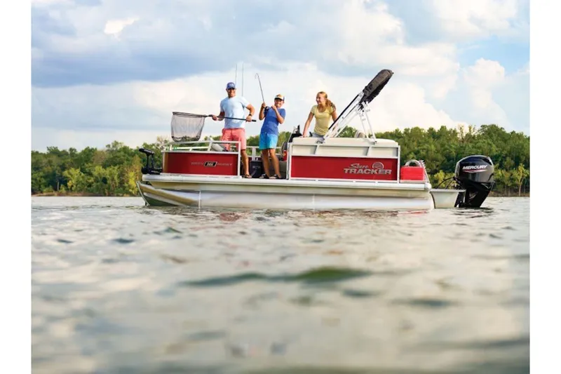 The Image of 2026 Sun Tracker Bass Buggy 16 XL Select pontoon boat on a lake with people fishing. - 1
