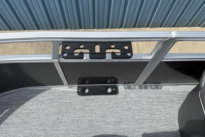 Slide: The Image of 2026 Sun Tracker Bass Buggy 16 XL Select boat interior with metal railing and mounting bracket. - 14