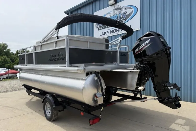 Slide: The Image of 2026 Sun Tracker Bass Buggy 16 XL Select pontoon boat with Mercury outboard motor. - 16