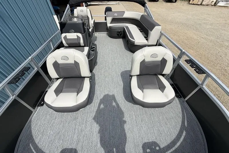 Slide: The Image of 2026 Sun Tracker Bass Buggy 16 XL Select pontoon boat interior with cushioned seating. - 17