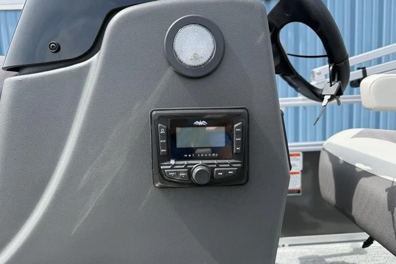 Slide: The Image of Control panel of 2026 Sun Tracker Bass Buggy 16 XL Select boat with audio system. - 19
