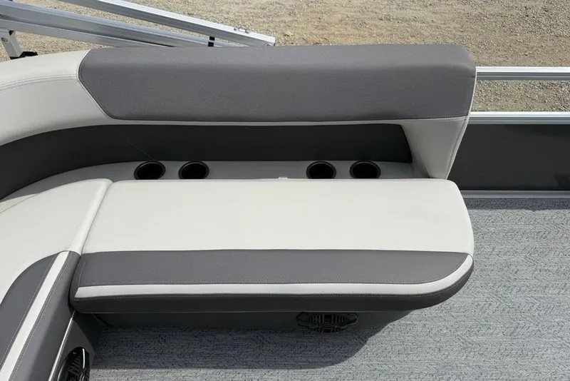 Slide: The Image of 2026 Sun Tracker Bass Buggy 16 XL Select boat seating with cup holders and gray upholstery. - 21