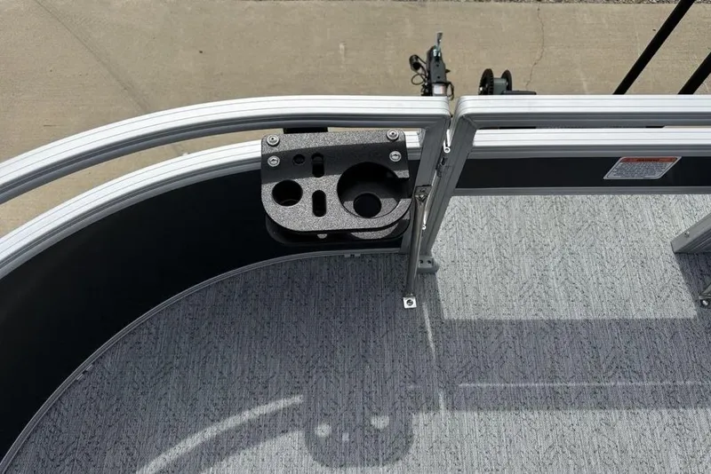 Slide: The Image of 2026 Sun Tracker Bass Buggy 16 XL Select boat deck with cup holder and railing. - 6
