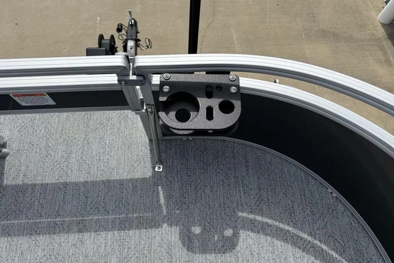Slide: The Image of 2026 Sun Tracker Bass Buggy 16 XL Select boat deck with cup holders and railing. - 7