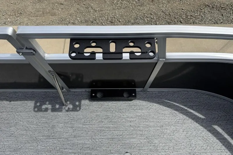 Slide: The Image of 2026 Sun Tracker Bass Buggy 16 XL Select boat interior with metal railing and mounting bracket. - 8