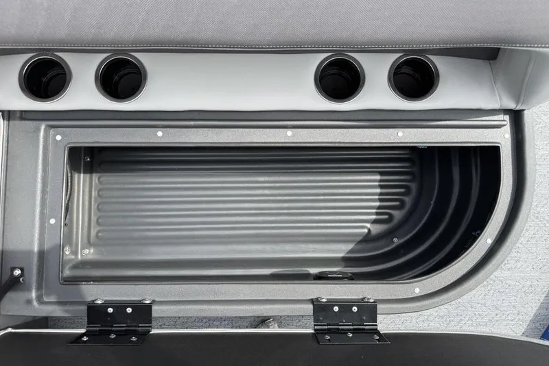 Slide: The Image of 2026 Sun Tracker Bass Buggy 16 XL Select storage compartment with cup holders. - 9