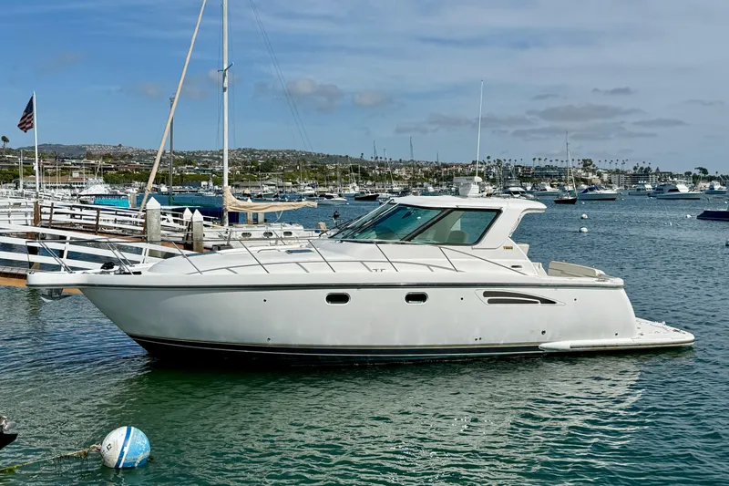 The Image of 2006 Tiara Yachts 3600 Sovran in marina, calm waters, clear sky. - 0