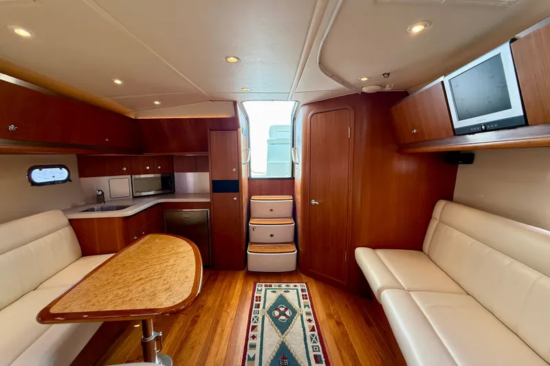 Slide: The Image of Luxurious interior of 2006 Tiara Yachts 3600 Sovran with wood finishes and modern amenities. - 2
