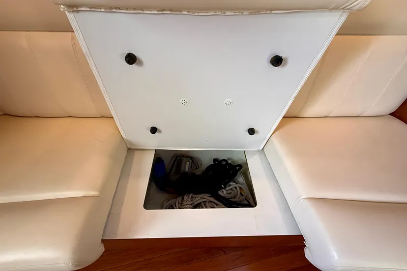 Slide: The Image of Storage compartment on a 2006 Tiara Yachts 3600 Sovran, featuring ropes and accessories. - 20
