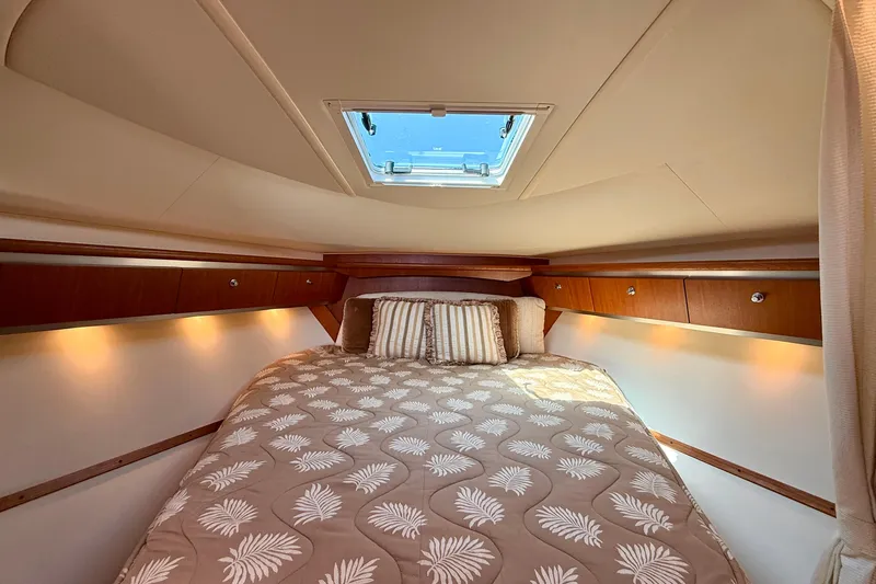 Slide: The Image of Luxurious cabin interior of 2006 Tiara Yachts 3600 Sovran with elegant bedding and ambient lighting. - 22