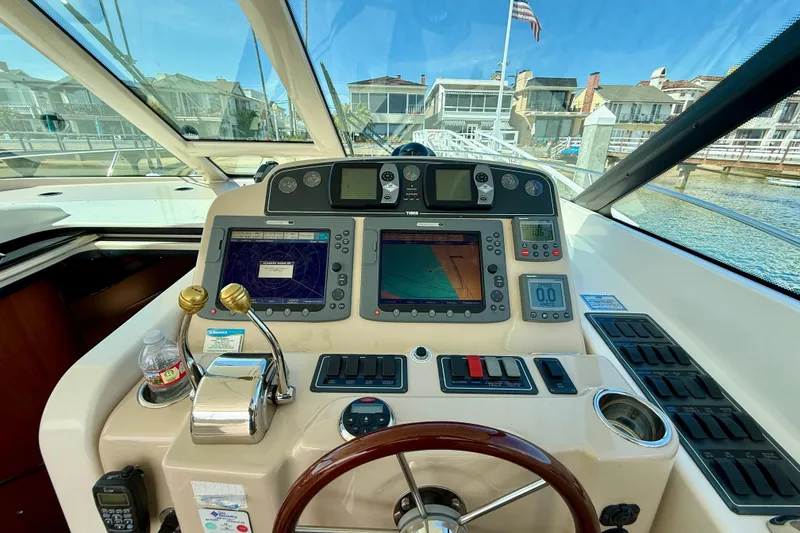 Slide: The Image of Helm of 2006 Tiara Yachts 3600 Sovran with navigation equipment and controls. - 28