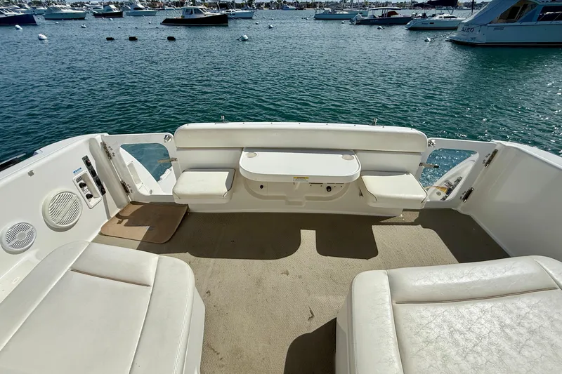 Slide: The Image of 2006 Tiara Yachts 3600 Sovran cockpit with seating, overlooking marina waters. - 38