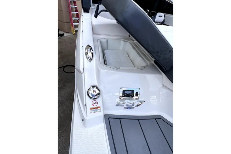 Slide: The Image of 2020 Chaparral 237 SSX boat interior with sleek seating and modern dashboard. - 13