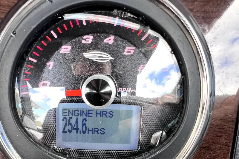 Slide: The Image of Dashboard of 2020 Chaparral 237 SSX showing 254.6 engine hours. - 22
