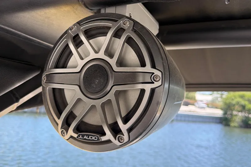 Slide: The Image of Boat speaker on 2020 Chaparral 237 SSX, mounted under canopy by the water. - 24