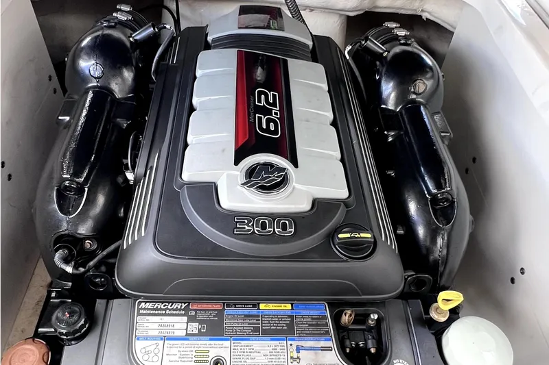 Slide: The Image of 2020 Chaparral 237 SSX boat engine compartment featuring a powerful Mercury 6.2L engine. - 27