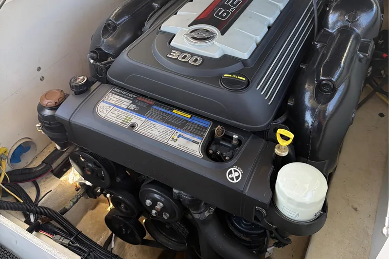 Slide: The Image of Engine compartment of a 2020 Chaparral 237 SSX boat, featuring a 6.2L engine. - 29