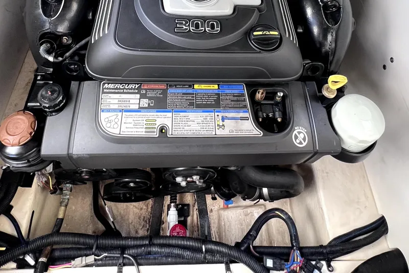 Slide: The Image of Engine compartment of 2020 Chaparral 237 SSX boat, featuring a powerful Mercury engine. - 30