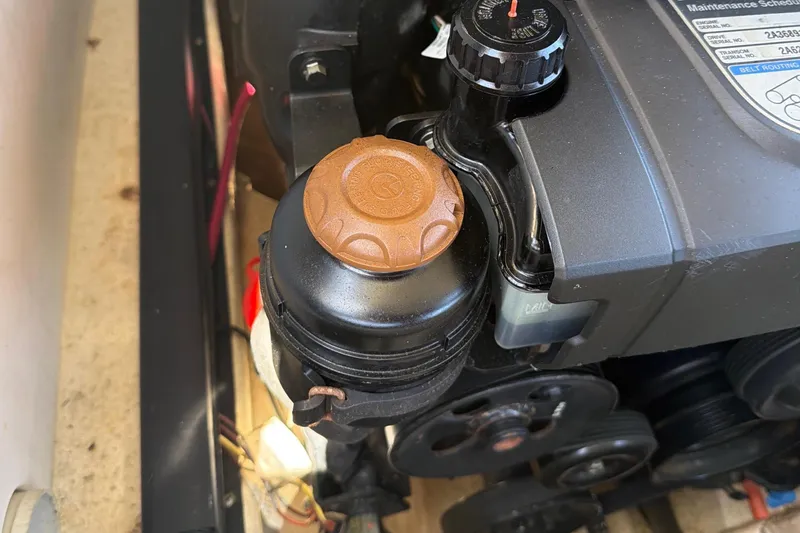 Slide: The Image of Engine compartment of 2020 Chaparral 237 SSX boat, featuring Mercury components. - 32