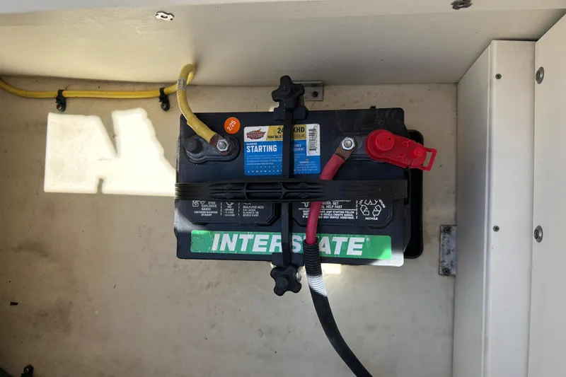 Slide: The Image of Battery compartment of a 2020 Chaparral 237 SSX boat with Interstate battery. - 33