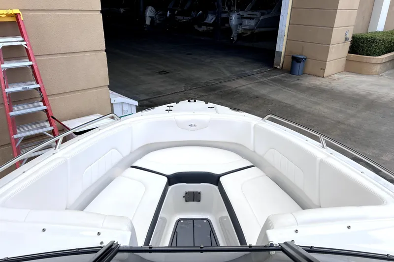 Slide: The Image of 2020 Chaparral 237 SSX boat on lift at marina, sunny day. - 5