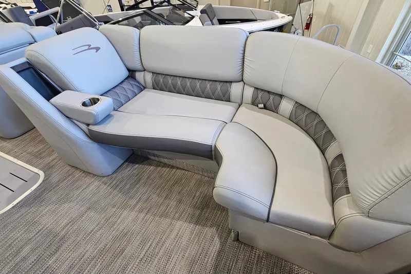 Slide: The Image of Luxurious seating on a 2020 Bennington 23 R Swingback pontoon boat, featuring plush upholstery. - 17