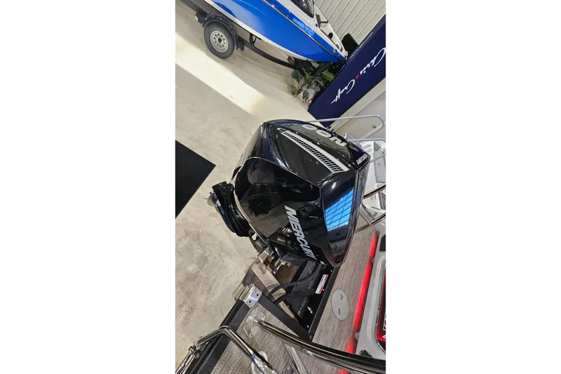 Slide: The Image of Mercury outboard motor on a 2020 Bennington 23 R Swingback boat in showroom. - 19