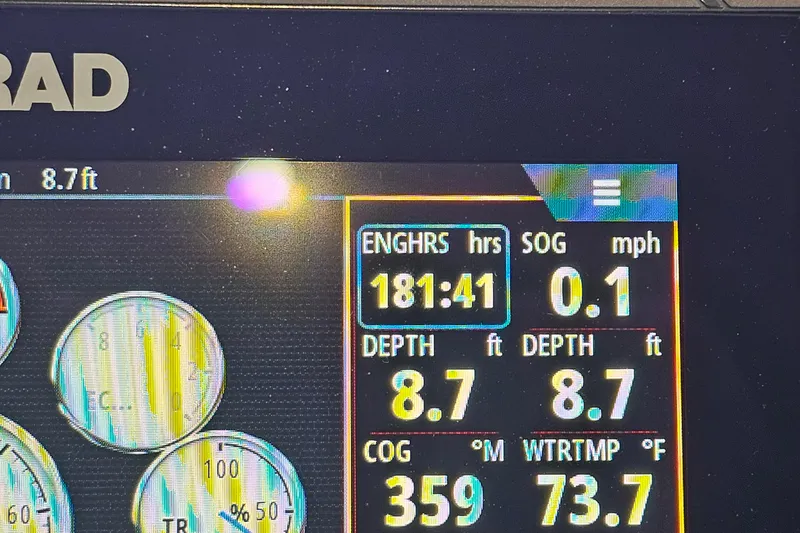 Slide: The Image of Boat dashboard display showing engine hours, speed, depth, and water temperature for 2020 Bennington 23 R Swingback. - 20