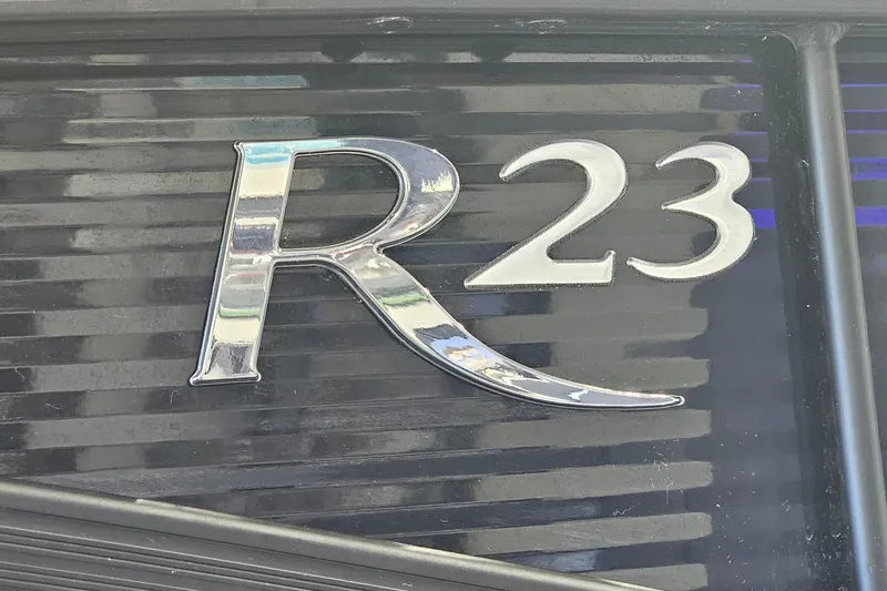 Slide: The Image of Chrome "R 23" emblem on a 2020 Bennington 23 R Swingback boat. - 22