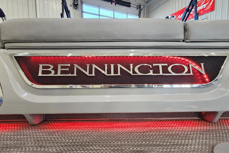 Slide: The Image of 2020 Bennington 23 R Swingback boat interior with illuminated logo and seating. - 23