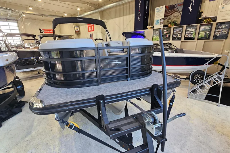 Slide: The Image of 2020 Bennington 23 R Swingback pontoon boat displayed in a showroom setting. - 3