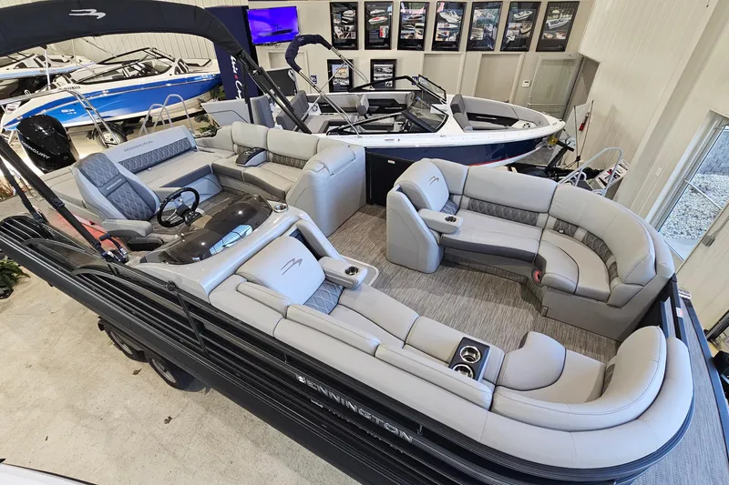 Slide: The Image of 2020 Bennington 23 R Swingback pontoon boat with luxurious seating in showroom display. - 5